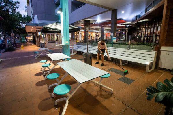 Workers pack up at a cafe in Brisbane, Australia, on June 29, 2021. (Jono Searle/Getty Images)