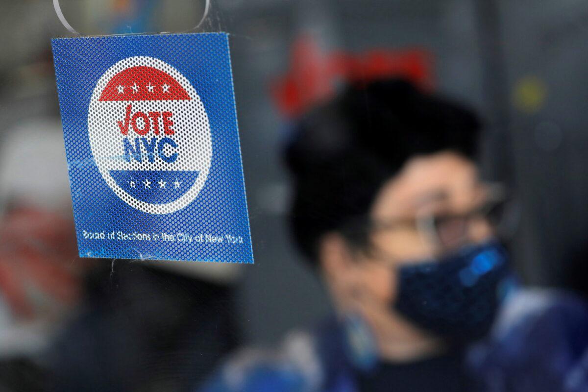Signage is seen at an early voting location ahead of New York City’s mayoral election in Harlem, New York City, on June 18, 2021. (Andrew Kelly/Reuters)