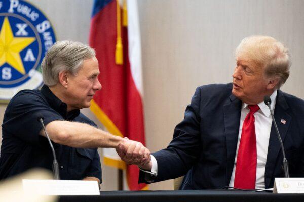 Texas Gov. Greg Abbott and former President Donald Trump shake hands during a border security briefing on June 30, 2021, in Weslaco, Texas. (Brandon Bell/Getty Images)
