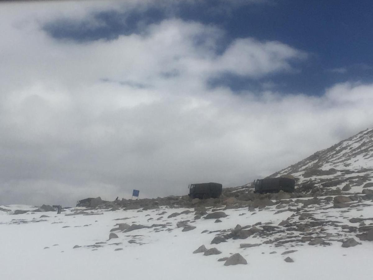 Two Indian army trucks move toward Changla pass, the second-highest mountain pass in the world at more than 16,800 feet above sea level, en route to Pangong Tso in Ladakh on June 22, 2021. (Venus Upadhayaya/Epoch Times)