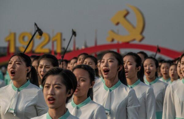 Chinese women sing at a ceremony marking the 100th anniversary of the Communist Party at Tiananmen Square in Beijing, China on July 1, 2021. (Kevin Frayer/Getty Images)