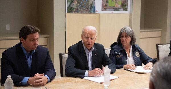 President Joe Biden speaks alongside Miami-Dade County Mayor Daniella Levine Cava (R) and Florida Governor Ron DeSantis (L) about the collapse of the 12-story Champlain Towers South condo building in Surfside, during a briefing in Miami Beach, Fla., on July 1, 2021. (Saul Loeb/AFP via Getty Images)