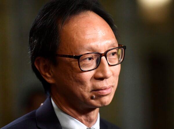 Sen. Yuen Pau Woo, facilitator of the Independent Senators Group, participates in a TV interview in the Senate foyer on Parliament Hill, in Ottawa on June 19, 2018. (The Canadian Press/Justin Tang)