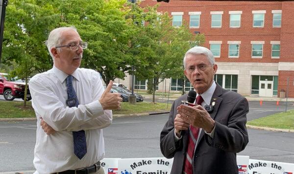 Former state senator Dick Black (right) with Eugene Delgaudio, president of Public Advocates, outside the Loudoun County Public School administration building on July 1. (Terri Wu/The Epoch Times)