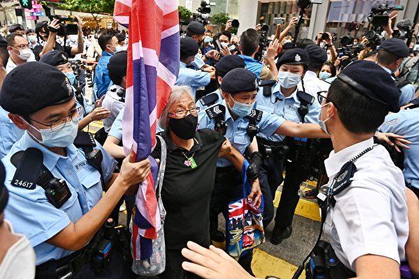 Hong Kong police arrests Alexandra Wong, a white-haired native activist, on July 1, 2021. (Song Bilong/The Epoch Times)