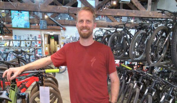Kyle McKendree, general manager for Absolute Bikes in Flagstaff, Arizona, on July 2, 2021. (Allan Stein/Epoch Times)