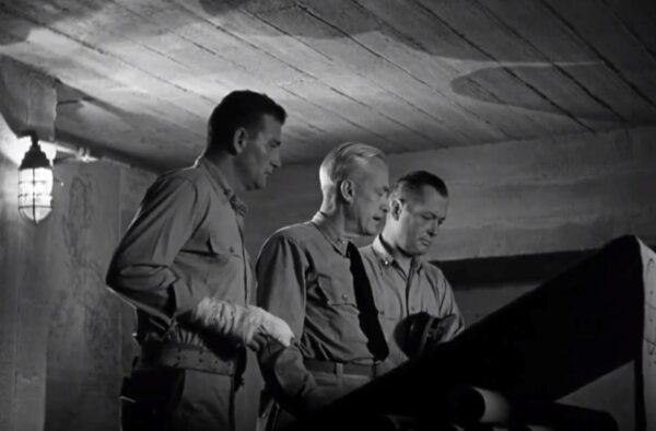 (L–R) John Wayne, Charles Trowbridge, and Robert Montgomery in “They Were Expendable.” (Metro-Goldwyn-Mayer)