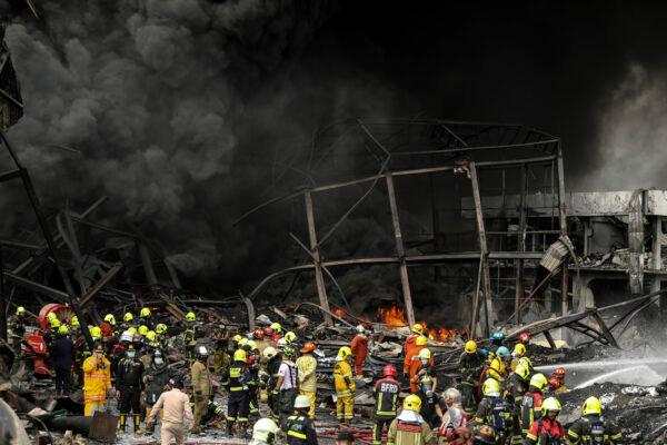 Firefighters work at the site of a massive explosion in Samut Prakan province, Thailand, on July 5, 2021. (Nava Natthong/AP Photo)