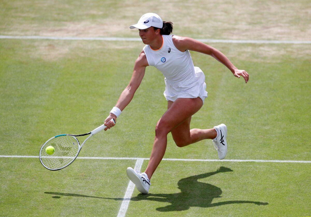 Poland's Iga Swiatek is in action during her fourth round match against Tunisia's Ons Jabeur at All England Lawn Tennis and Croquet Club, London, on July 2, 2021. (Paul Childs/Reuters)
