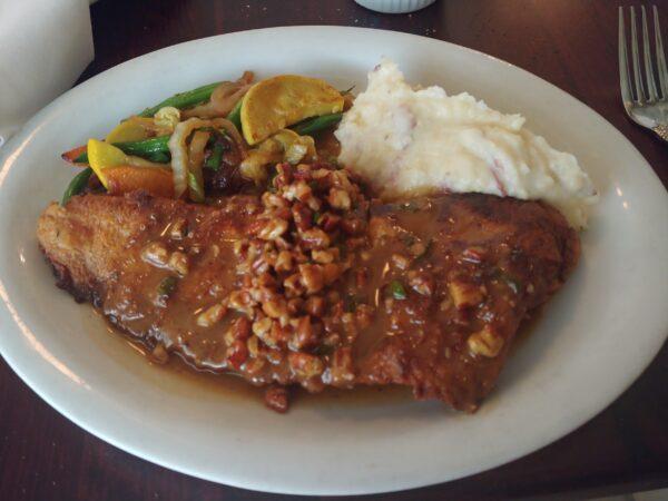 Pecan-crusted red drum at Brigtsen's Restaurant. (Melanie Young)