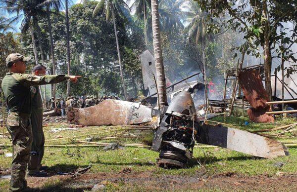 Parts of a Lockheed C-130 Hercules plane are seen at the crash site in Patikul town, Sulu province, southern Philippines, on July 4, 2021. (Joint Task Force-Sulu via AP)