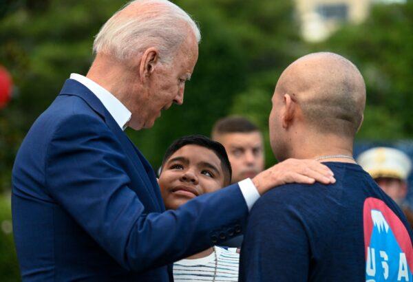 President Joe Biden (L) greets guests after delivering remarks during Independence Day celebrations on the South Lawn of the White House in Washington on July 4, 2021. (Andrew Caballero-Reynolds/AFP via Getty Images)