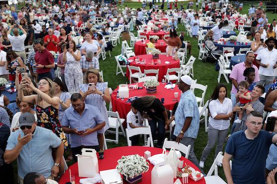 Guests listen to President Joe Biden's remarks during a Fourth of July BBQ event to celebrate Independence Day at the South Lawn of the White House in Washington on July 4, 2021. (Alex Wong/Getty Images)
