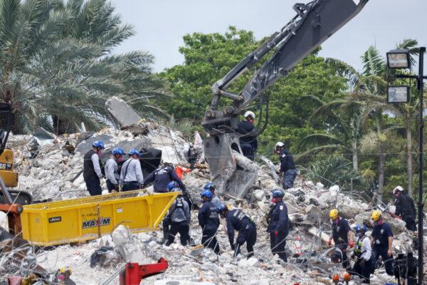 Search-and-rescue efforts resume the day after the managed demolition of the remaining part of Champlain Towers South complex in Surfside, Fla., on July 5, 2021. (Marco Bello/Reuters)
