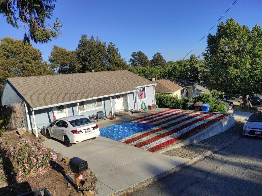 The American flag painting on Erin and Jonathan's lawn finished. (Courtesy of <a href="https://www.facebook.com/erin.mckay.5070">Erin McKay-Schnell</a>)