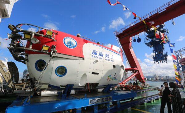 China's manned submersible Shenhai Yongshi (or Deepsea Warrior), on board the exploration ship Tansuo-1, returns to port after completing deepsea testing in Sanya, a city on Southeast China’s Hainan Island, on Oct. 3, 2017. (Sun Qing/Getty Images)