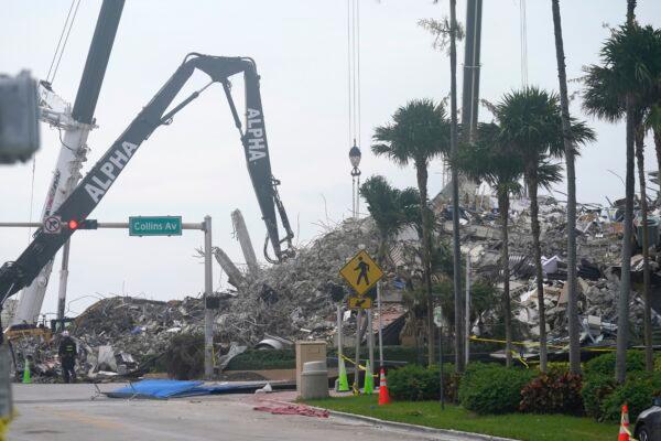 Rescue crews work in the rubble of the collapsed Champlain Towers South condominium building in Surfside, Fla., on July 6, 2021. (Lynne Sladky/AP Photo)