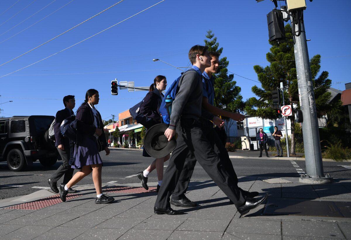 School students arrive for the first day of face-to-face schooling in Brisbane, Australia, on May 11, 2020. (AAP Image/Dan Peled)