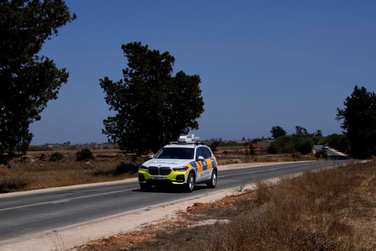 A police customs vehicle travels in the British military base, Cyprus, on July 6, 2021. (Petros Karadjias/AP Photo)