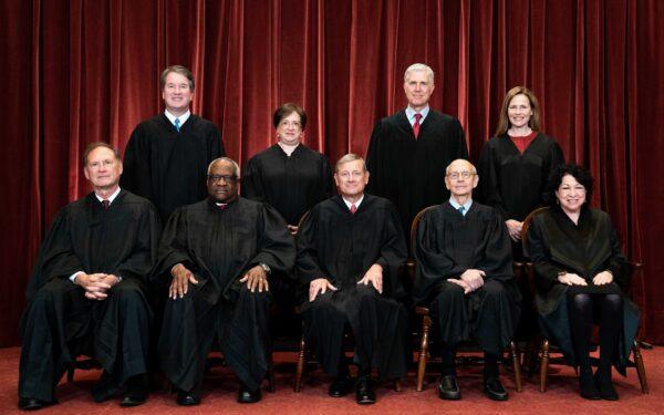 Members of the Supreme Court pose for a group photo at the Supreme Court in Washington on April 23, 2021. Seated from left: Associate Justice Samuel Alito, Associate Justice Clarence Thomas, Chief Justice John Roberts, Associate Justice Stephen Breyer, and Associate Justice Sonia Sotomayor. Standing from left: Associate Justice Brett Kavanaugh, Associate Justice Elena Kagan, Associate Justice Neil Gorsuch, and Associate Justice Amy Coney Barrett. (Erin Schaff/Pool/Getty Images)