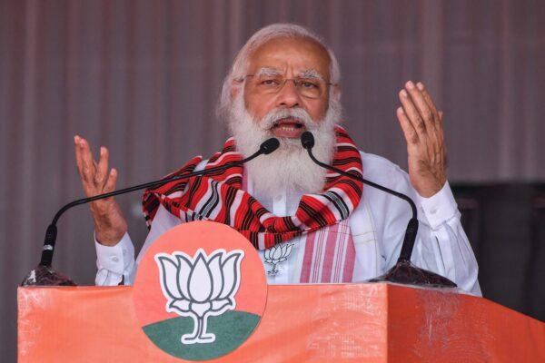 India's Prime Minister Narendra Modi gestures as he addresses a public meeting ahead of Assam Assembly elections, in Bokakhat, India, on March 21, 2021. (Biju Boro/AFP via Getty Images)