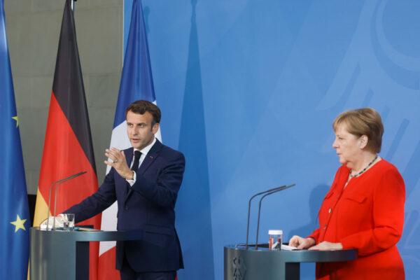 BERLIN, GERMANY - JUNE 18: French President Emmanuel Macron speaks as he and German Chancellor Angela Merkel give a news statement on June 18, 2021 in Berlin, Germany. (Photo by Axel Schmidt - Pool/Getty Images)