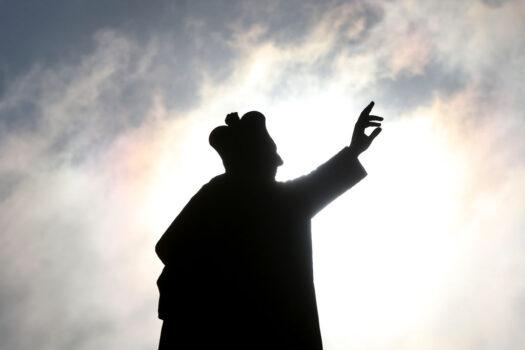 A statue is seen silhouetted by the sun at St. Mary's Cathedral in Sydney, Australia, on Oct. 23, 2020. (Lisa Maree Williams/Getty Images)