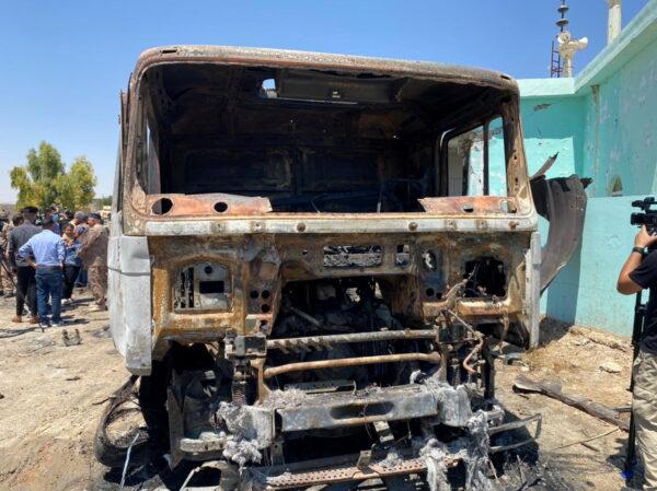 A truck from which rockets were launched towards Ain Al-Asad Military Base is seen at Anbar province, in al-Baghdadi, Iraq, on July 8, 2021. (Joint Operations Command Media Office/Handout via Reuters)