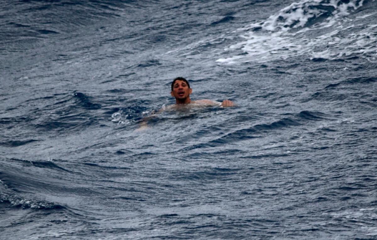A man treads water and awaits rescue crews approximately 32 miles southeast of Key West, Fla., on July 6, 2021. (U.S. Coast Guard via AP)