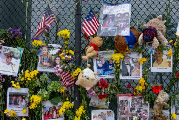 Mementos and flowers are seen displayed at the Surfside Wall of Hope Memorial in Surfside, Fla., on July 7, 2021. (Al Diaz/Miami Herald via AP)