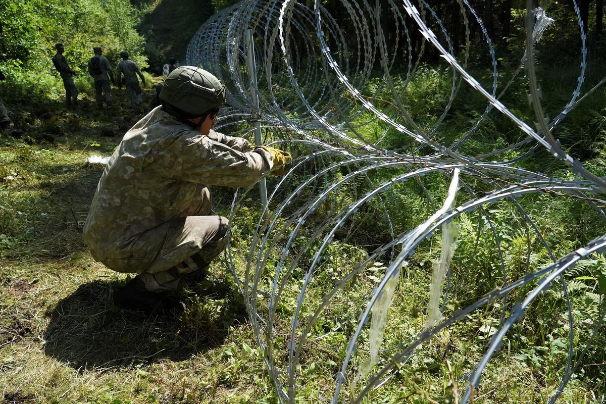 Lithuania Toughens Belarus Border With Razor Wire to Bar Migrants