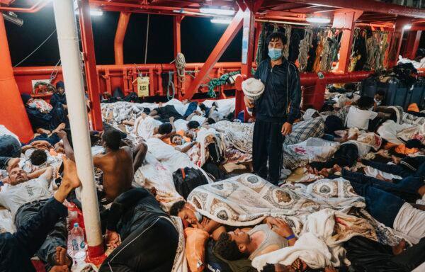 Migrants sleep on the deck of the Ocean Viking rescue in the Mediterranean Sea, on July 5, 2021. (Flavio Gasperini/SOS Mediterranee via AP)