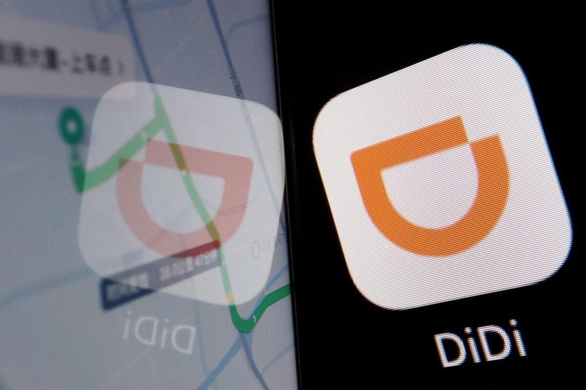 The app logo of Chinese ride-hailing giant Didi is seen reflected on its navigation map displayed on a mobile phone on July 1, 2021. (Florence Lo/Reuters)