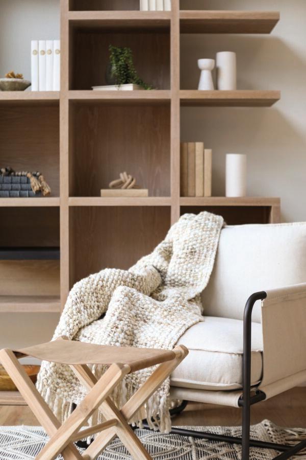 Texturize your room with throw blankets and other materials to add interest and create balance. (Ginger Curtis)