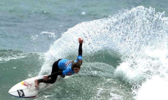 Teen Surfer Rides Memorable Wave to Tokyo