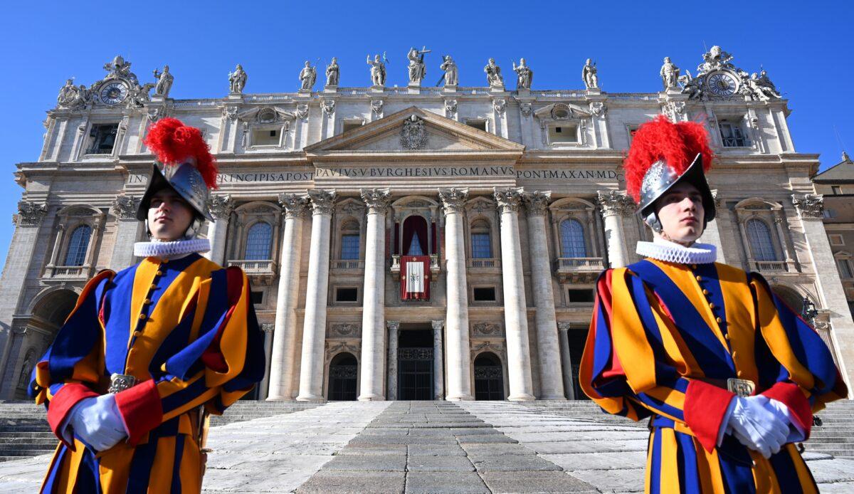 Swiss guards stand in front of St Peter's Basilica before the appearance of Pope Francis at the balcony for the traditional "Urbi et Orbi" Christmas message to the city and the world, at St Peter's square in the Vatican, on December 25, 2019. (Alberto Pizzoli/AFP via Getty Images)