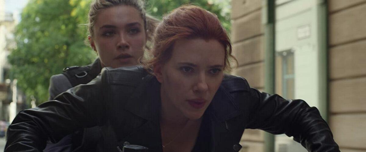 "Sisters" Yelena (Florence Pugh, L) and Natasha (Scarlett Johansson) escaping bad guys on a motorcycle, in “Black Widow.” (Marvel/DisneyPlus)