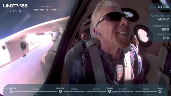 In a still image from video, Billionaire Richard Branson smiles on board Virgin Galactic's passenger rocket plane VSS Unity before starting its untethered ascent to the edge of space above Spaceport America near Truth or Consequences, N.M., on July 11, 2021. (Virgin Galactic/Handout via Reuters)