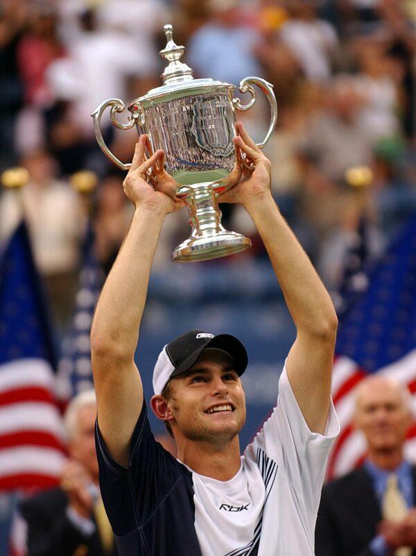 Andy Roddick of the United States raises the trophy after defeating Juan Carlos Ferrero of Spain, 6-3, 7-6 (7/2), 6-3, in the men's final match at the U.S. Open tennis championships in Flushing Meadows, N.Y., on Sept. 7, 2003. (Stan Honda/AFP via Getty Images)