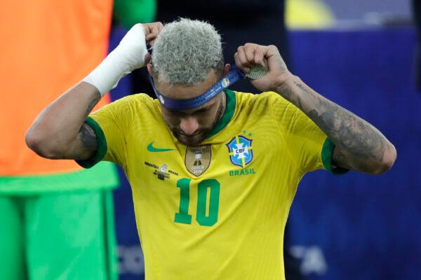 Brazil's Neymar takes off the second place medal during the award ceremony for the Copa America at Maracana stadium in Rio de Janeiro, Brazil, on July 10, 2021. (Andre Penner/AP Photo)