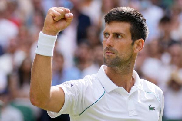 Serbia's Novak Djokovic celebrates after winning a point against Italy's Matteo Berrettini during the men's singles final on day thirteen of the Wimbledon Tennis Championships in London, England, on July 11, 2021. (Kirsty Wigglesworth/AP Photo)