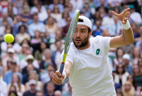 Italy's Matteo Berrettini plays a return to Serbia's Novak Djokovic during the men's singles final on day thirteen of the Wimbledon Tennis Championships in London, England, on July 11, 2021. (Kirsty Wigglesworth/AP Photo)