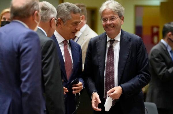 European Commissioner for Economy Paolo Gentiloni (second right) speaks with Fabio Panetta, member of the Executive Board of the ECB (third left) during a meeting of the eurogroup finance ministers at the European Council building in Brussels on July 12, 2021. (Virginia Mayo/AP)