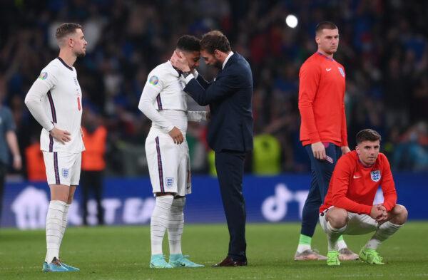 Gareth Southgate, head coach of England, consoles Jadon Sancho following defeat in the UEFA Euro 2020 Championship Final between Italy and England at Wembley Stadium, London, on July 11, 2021. (Laurence Griffiths/Getty Images)