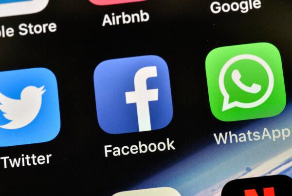 The icons of Facebook and WhatsApp are pictured on an iPhone in Gelsenkirchen, Germany, on Nov. 15, 2018. (Martin Meissner/AP Photo)