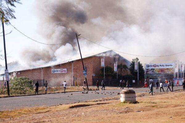 A supermarket burns as protests continue in Pietermaritzburg, South Africa, on July 12, 2021. (Rogan Ward/Reuters)