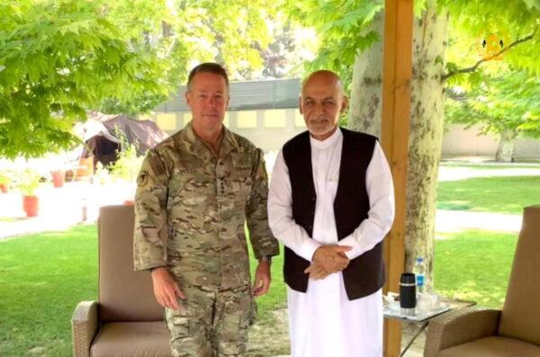 Afghanistan's President Ashraf Ghani (R) meets General Austin "Scott" Miller, commander of U.S. forces and NATO's Resolute Support Mission in Kabul, Afghanistan, on July 2, 2021. (Presidential Palace/Handout via Reuters)