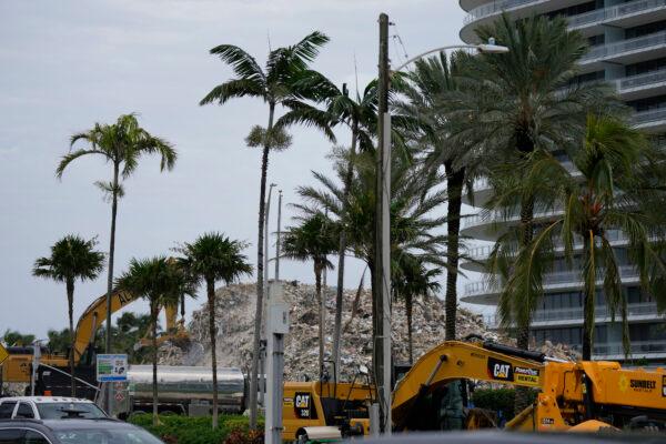 Crews work to clear the rubble of the demolished section of the Champlain Towers South building in Surfside, Fla., on July 12, 2021. (Rebecca Blackwell/AP Photo)