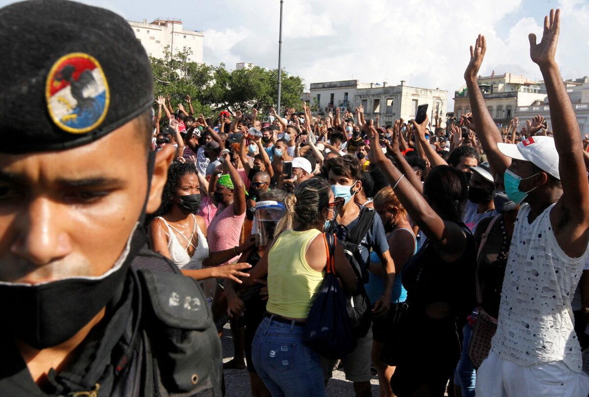 People react during protests in Havana, Cuba, on July 11, 2021. (Stringer/Reuters)