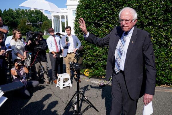 Sen. Bernie Sanders (I-Vt.) talks to reporters outside the West Wing of the White House on July 12, 2021. (AP Photo/Susan Walsh)